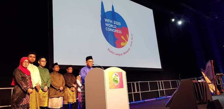 Taqrir Akramin Khalib, President of Hemophilia Society of Malaysia delivering his speech during the destination handover ceremony at the WFH Congress 2018 held in Glasgow, Scotland